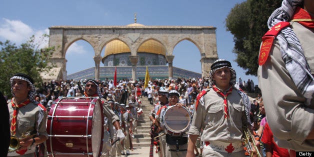 Palestinian scouts take part in celebrations marking the Muslim holiday 'Israa and Miraj', the day on which, according to tra