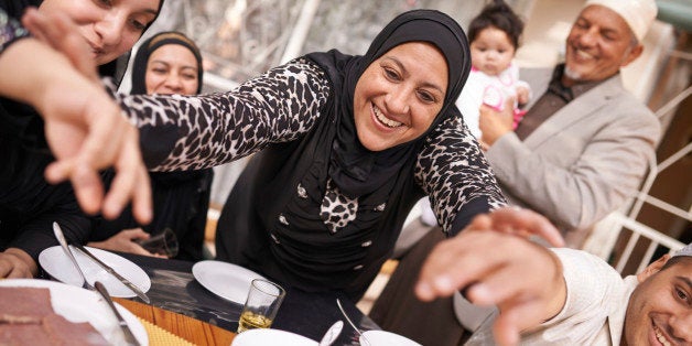 Shot of a muslim family eating together