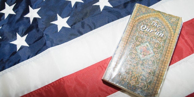 Close-up of Holy Quran on American flag.