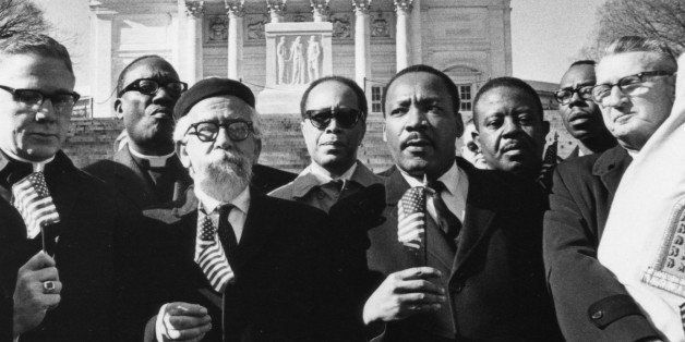 UNSPECIFIED - MARCH 13: 'Leaders of the protest, holding flags, from left Bishop James Shannon, Rabbi Abraham Heschel, Dr. Martin Luther King and Rabbi Maurice Eisendrath.' Tomb of the Unknown Soldier, Arlington Cemetery, February 6, 1968. Published February 7, 1968. (Photo by Charles Del Vecchio/Washington Post/Getty Images)
