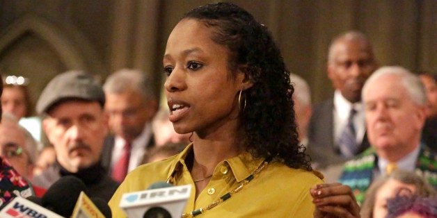 Wheaton College professor Larycia Hawkins speaks during a news conference Wednesday, Jan. 6, 2016, in Chicago. Hawkins, who's Christian, posted her views on Facebook and wore a headscarf to show solidarity with Muslims is disputing the university's account of interactions with administrators who've initiated steps to fire her. Suburban Chicago's Wheaton College initiated the termination-for-cause proceeding against Hawkins on Tuesday, saying she refused to participate in "clarifying conversations" about theological issues. (AP Photo/M. Spencer Green)