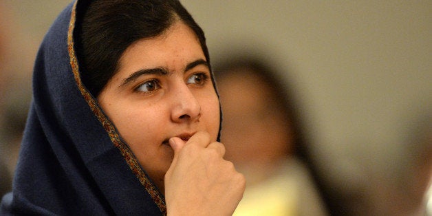 Pakistani activist for female education and Nobel Peace Prize laureate Malala Yousafzai listens to speakers at an event to co