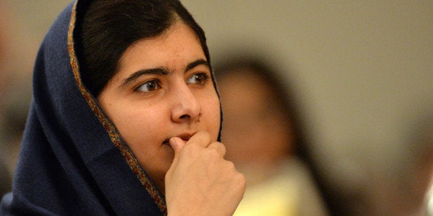 Pakistani activist for female education and Nobel Peace Prize laureate Malala Yousafzai listens to speakers at an event to commemorate the Peshawar school massacre in Birmingham, north England on December 14, 2015. On December 16, 2014 Taliban gunmen coldly slaughtered more than 150 people, most of them children, at an army-run school in Peshawar. AFP PHOTO / PAUL ELLIS / AFP / PAUL ELLIS (Photo credit should read PAUL ELLIS/AFP/Getty Images)