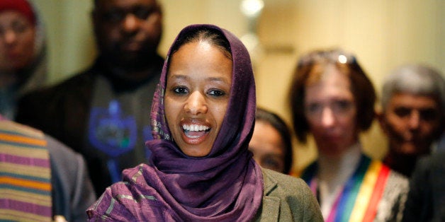 Wheaton College associate professor Larycia Hawkins talks to reporters during a news conference Wednesday, Dec. 16, 2015, in Chicago. Hawkins, a Christian teaching political science at the private evangelical school west of Chicago, who is wearing a headscarf to demonstrate solidarity with Muslims was put on leave Tuesday after making statements about the faiths' similarities that the college said conflicted with its "distinctively evangelical" identity. (AP Photo/Charles Rex Arbogast)