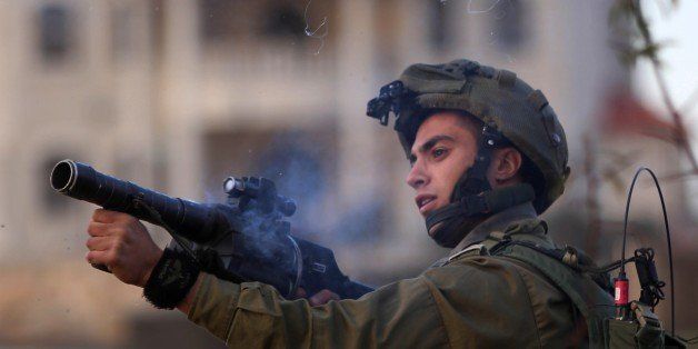 RAMALLAH, WEST BANK - JANUARY 15: Israeli soldiers intervenes to Palestinian protest against Israeli violations, in Ramallah, West Bank on January 15, 2016. (Photo by Shadi Hatem/Anadolu Agency/Getty Images)