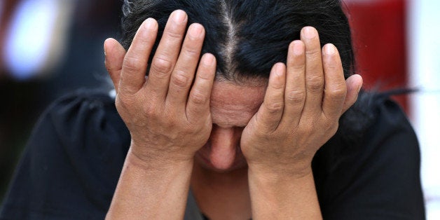 A Lebanese woman weeps for her relative, one of two soldiers killed Friday by a roadside bomb, during their funeral processi