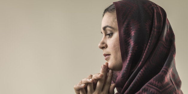 Portrait of young woman wearing hijab head scarf