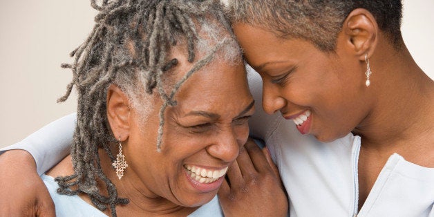 Grown daughter hugging mother