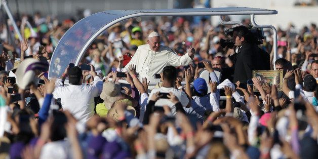 People greet Pope Francis during outdoor Mass Wednesday, Feb. 17, 2016, in Ciudad Juarez, Mexico. (AP Photo/Gregory Bull)