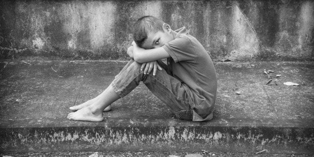 Young Asian boy, scared and alone. Hoping for a better future than the one that seems set. He is at high risk of being physic