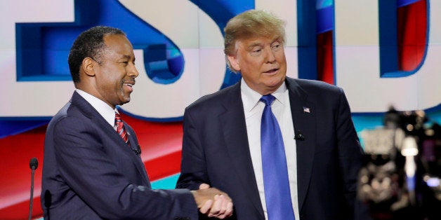 Republican presidential candidate, retired neurosurgeon Ben Carson, left, and Republican presidential candidate, businessman Donald Trump shake hands after a Republican presidential primary debate at The University of Houston, Thursday, Feb. 25, 2016, in Houston. (AP Photo/David J. Phillip)