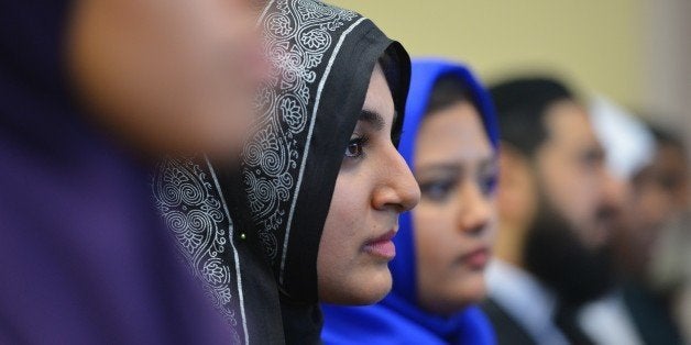 Women watch as US President Barack Obama speaks at the Islamic Society of Baltimore, in Windsor Mill, Maryland on February 3, 2016.Obama offered an impassioned rebuttal of 'inexcusable' Republican election rhetoric against Muslims Wednesday, on his first trip to an American mosque since becoming president seven years ago. / AFP / MANDEL NGAN (Photo credit should read MANDEL NGAN/AFP/Getty Images)