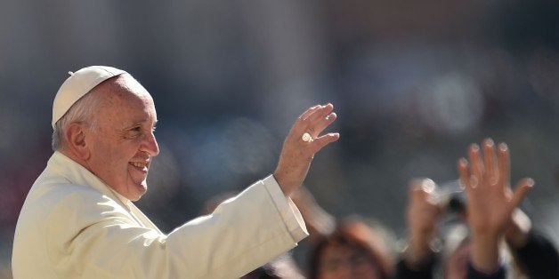 Pope Francis greets the crowd during his weekly general audience at St Peter's square on March 2, 2016 at the Vatican. AFP PHOTO / VINCENZO PINTO / AFP / VINCENZO PINTO (Photo credit should read VINCENZO PINTO/AFP/Getty Images)