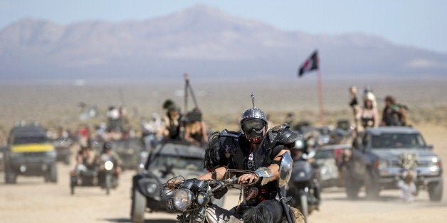 An enthusiast rides his customized motorcycle during the Wasteland Weekend event in California City, California September 26, 2015. The four-day event has a post-apocalyptic theme and is inspired by the Mad Max movie franchise. Picture taken September 26, 2015. REUTERS/Mario Anzuoni