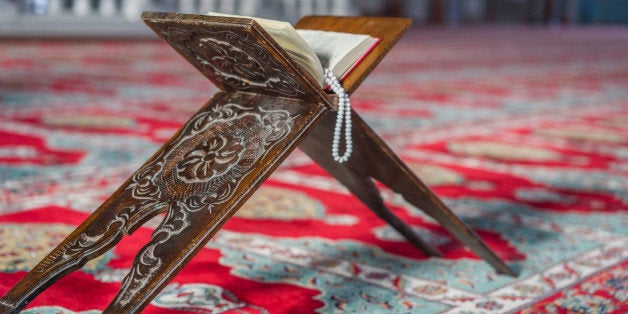 Koran standing on a stand in the mosque,rosary beads