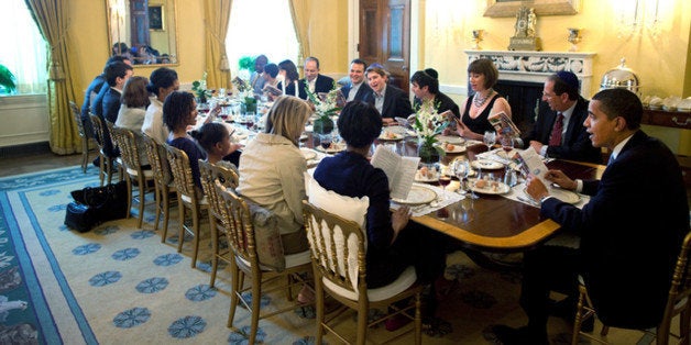 U.S. President Barack Obama and Michelle Obama host a Passover Seder Dinner with friends and staff in the Old Family Dining Room at the White House in Washington, in this handout photograph taken on April 2009 and later released by the White House. Photo resolution is the maximum available from source. REUTERS/Pete Souza/The White House/Handout (UNITED STATES POLITICS) FOR EDITORIAL USE ONLY. NOT FOR SALE FOR MARKETING OR ADVERTISING CAMPAIGNS