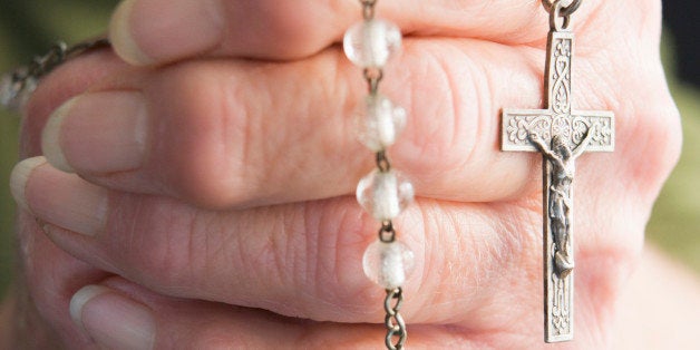 Close-Up Of Elderly Person Holding Rosary Beads