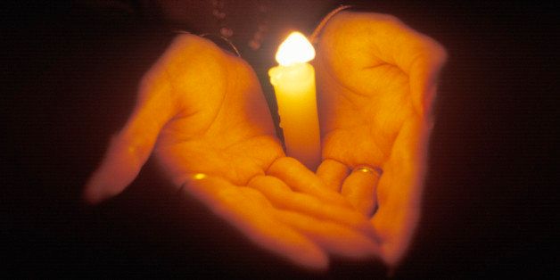 Hands Holding Candle