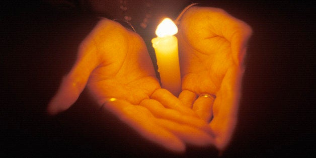 Hands Holding Candle