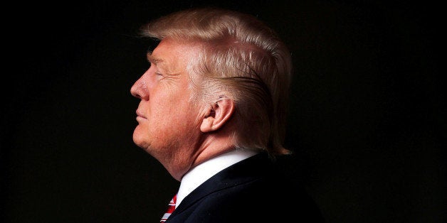 Republican U.S. presidential candidate Donald Trump poses for a photo after an interview with Reuters in his office in Trump
