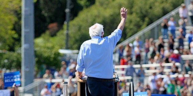 Democratic presidential candidate Sen. Bernie Sanders, I-Vt., waves to supporters at a rally on Sunday, May 22, 2016, in Vista, Calif. (AP Photo/Sandy Huffaker)