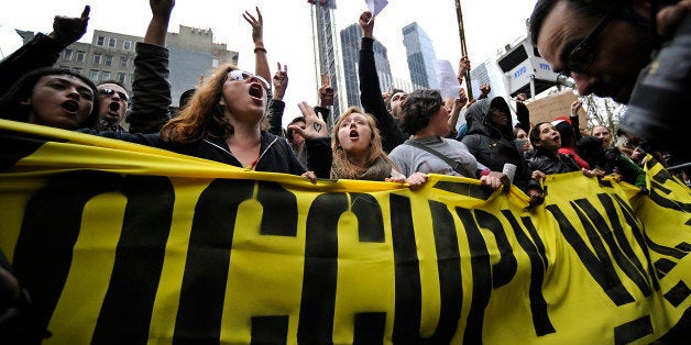 Demonstrators from the Occupy Wall Street movement march from Foley Square back to Zuccoti Park in New York, U.S., on Tuesday, Nov. 15, 2011. New York City police in riot gear swept into a Lower Manhattan park early today to remove Occupy Wall Street demonstrators, who had been camping there for more than eight weeks to protest income inequality. Photographer: Peter Foley/Bloomberg via Getty Images