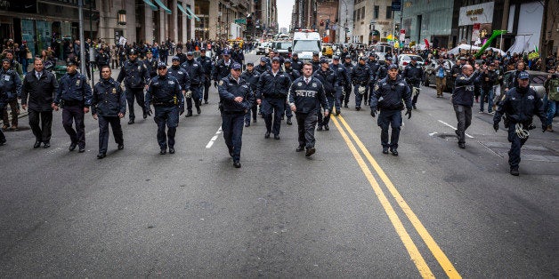 MIDTOWN MANHATTAN, NEW YORK CITY, NEW YORK, UNITED STATES - 2016/03/19: Policemen flooded the street during the anti-Trump r