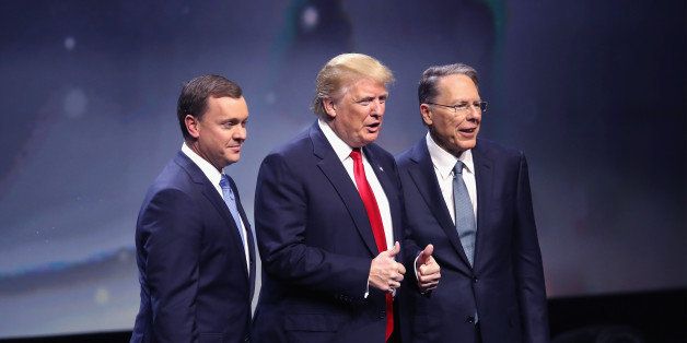 LOUISVILLE, KY - MAY 20: Republican presidential candidate Donald Trump is introduced with Chris Cox (L), Executive Director of the NRA Institute for Legislative Action and Wayne LaPierre (R), Executive Vice President of the National Rifle Association, at the National Rifle Association's NRA-ILA Leadership Forum during the NRA Convention at the Kentucky Exposition Center on May 20, 2016 in Louisville, Kentucky. The NRA announced their endorsement of Trump at the convention. The convention runs May 22. (Photo by Scott Olson/Getty Images)