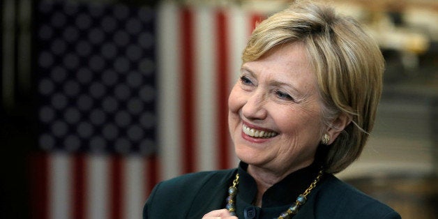U.S. Democratic presidential candidate Hillary Clinton smiles as she listens to her introduction at a campaign event in Athen