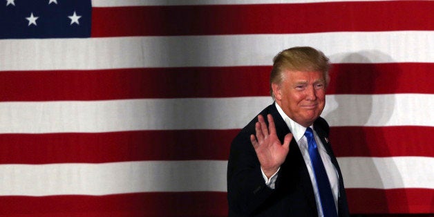 In this May 19, 2016 photo, Republican presidential candidate, Donald Trump, waves during a campaign event in Lawrenceville, N.J. Trump faces a struggle proving himself to white, suburban women, who could be crucial in the November general election. (AP Photo/Mel Evans)