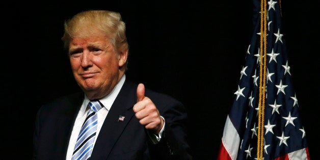 Republican U.S. presidential candidate Donald Trump gestures to supporters while speaking in Bismarck, North Dakota, U.S., Ma