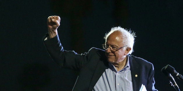 US Democratic presidential candidate Bernie Sanders waves to supporters during a rally at Santa Monica High School Football F