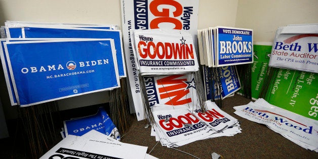 Yard signs for several democratic candidates including several for U.S. President Barack Obama are seen in a back room at the Mecklenburg County Democratic Party office in Charlotte, North Carolina November 5, 2012. REUTERS/Chris Keane (UNITED STATES - Tags: POLITICS ELECTIONS USA PRESIDENTIAL ELECTION)