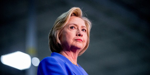 Democratic presidential candidate Hillary Clinton stands on stage at the Union of Carpenters and Millwrights Training Center during a campaign stop in Louisville, Ky., Sunday, May 15, 2016. (AP Photo/Andrew Harnik)