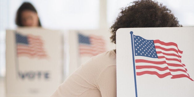 USA, New Jersey, Jersey City, Woman in voting booth