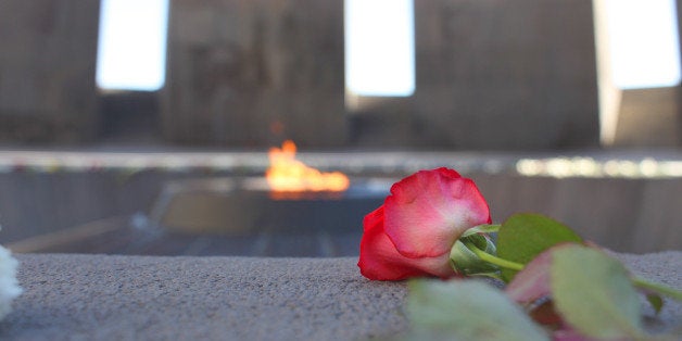 Armenian Genocide Memorial Complex (Tsitsernakaberd) in Yerevan, Armenia. Built in 1967 and dedicated to the victims of Armenian genocide of 1915. Twelve slabs are positioned in a circle, representing the 12 lost provinces in present day Turkey. In the center of the circle, at a depth of 1.5 meters, there is an eternal flame dedicated to the 1.5 million people killed during the Armenian Genocide.