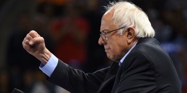 TOPSHOT - Democratic presidential candidate Bernie Sanders addresses a primary election night rally in Carson, California, May 17, 2016. Sanders scored a decisive victory over Hillary Clinton in the Democratic primary in Oregon, boosting his argument for keeping his underdog campaign alive through the conclusion of the primary process. Several US networks called the Pacific northwest state for the liberal Sanders, who was leading the former secretary of state 53 percent to 47 percent. Earlier in the night, Clinton claimed victory in an extraordinarily tight race in the state of Kentucky. / AFP / ROBYN BECK (Photo credit should read ROBYN BECK/AFP/Getty Images)