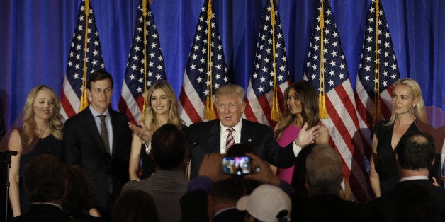 Republican U.S. presidential candidate Donald Trump is surrounded by members of his family as he speaks at a campaign event on the day that several states held presidential primary elections, including California, at the Trump National Golf Club Westchester in Briarcliff Manor, New York, U.S., June 7, 2016. REUTERS/Mike Segar TPX IMAGES OF THE DAY