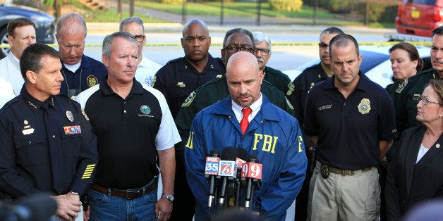 Law enforcement agencies and local city representatves give a news conference on Sunday, June 12, 2016, in the wake of a mass-casualty shooting at the Pulse nightclub in Orlando, Fla. (Jacob Langston/Orlando Sentinel/TNS via Getty Images)