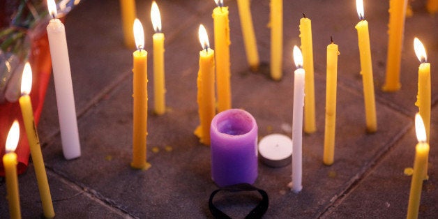 BANGKOK, THAILAND - JUNE 13: A black ribbon sits on the floor amidst candles during a vigil for the attack at the gay club in Orlando, on Monday, June 13, in Bangkok, Thailand. (Photo by Dario Pignatelli/Getty Images)