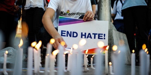 MANILA, PHILIPPINES - JUNE 14: A youth activist light candles as they gather for a vigil in solidarity with the victims of the mass shooting at the Pulse nightclub in Orlando, Florida on June 14, 2016 in Manila, Philippines. 49 people were killed after a gunman opened fire at nightclub frequented by gays lesbians and transgender people in the deadliest mass shooting in US history. (Photo by Dondi Tawatao/Getty Images)