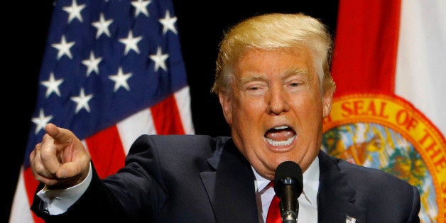 Republican U.S. presidential candidate Donald Trump gestures during a campaign rally in Tampa, Florida, U.S. June 11, 2016.