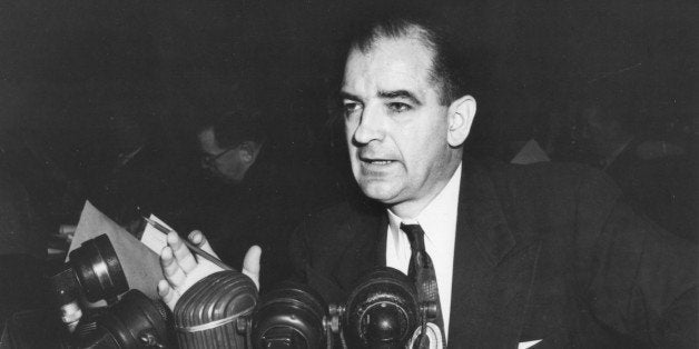 American politian US Senator Joseph R. McCarthy (1908 - 1957) speaks from behind a bank of microphones, mid 20th century. (Ph