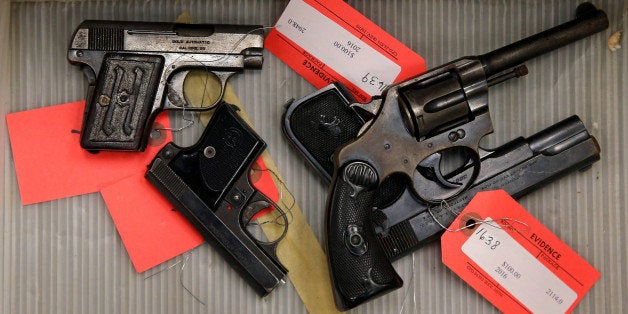 Handguns turned in from the public as part of the "Gun Turn-in" event where a gift card is given for every firearm turned over to Chicago Police are seen in a box at Universal Missionary Baptist Church in Chicago, Illinois, U.S. May 28, 2016. REUTERS/Jim Young