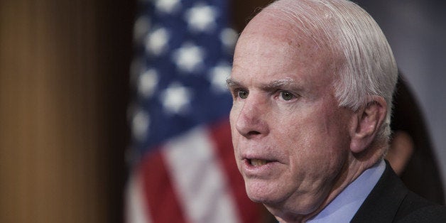 WASHINGTON, D.C. - JANUARY 13: Senator John McCain speaks at a press conference with Senator Kelly Ayotte (not seen), Senator Lindsey Graham (not seen), and Senator Richard Burr (not seen) to announce new proposed legislation to prevent President Obama from releasing prisoners from Guantanamo in Washington, D.C. on January 13, 2015. (Photo by Samuel Corum/Anadolu Agency/Getty Images)