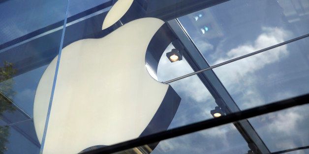 The Apple logo is seen atop the Apple Store Thursday, March 31, 2016, in Palo Alto, Calif. (AP Photo/Eric Risberg)
