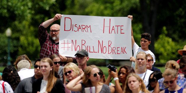People hold a sign which reads "Disarm Hate #NoBillNoBreak" as U.S. House Minority Leader Nancy Pelosi (D-CA) (not pictured) holds a news conference to call on House Speaker Paul Ryan to allow a vote on gun violence prevention legislation outside Capitol Hill in Washington, U.S., June 22, 2016. REUTERS/Carlos Barria