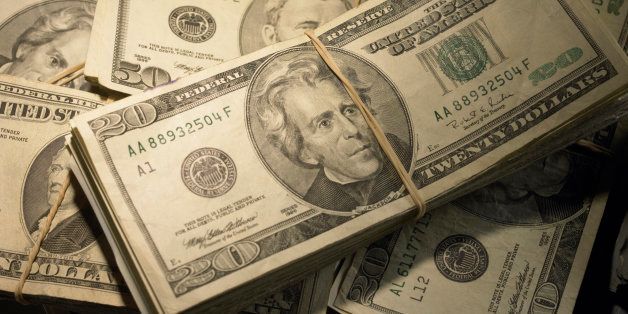 US Currency: Wads of US bills fastened with rubber bands, close-up