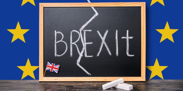 Brexit UK EU referendum concept cut Great Britain apart from rest of European union with flags and handwriting text written in chalkboard, close up