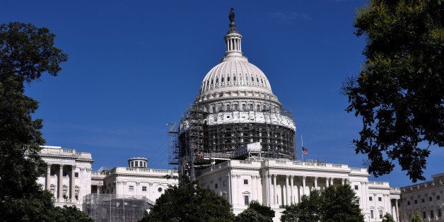 The U.S. flag flies at half-staff over the U.S. Capitol later in the day following the deadliest mass shooting in U.S. history at a gay nightclub in Orlando, Florida in Washington June 12, 2016. REUTERS/James Lawler Duggan